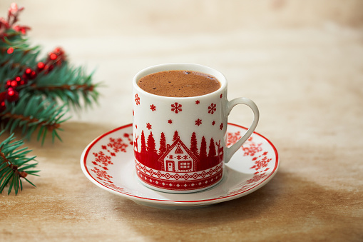 Turkish coffee in a christmas themed cup on christmas background
