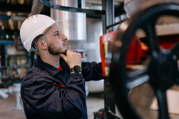 istock A young Caucasian engineer is making adjustments on a machine with a serious look on his face. 1655446114