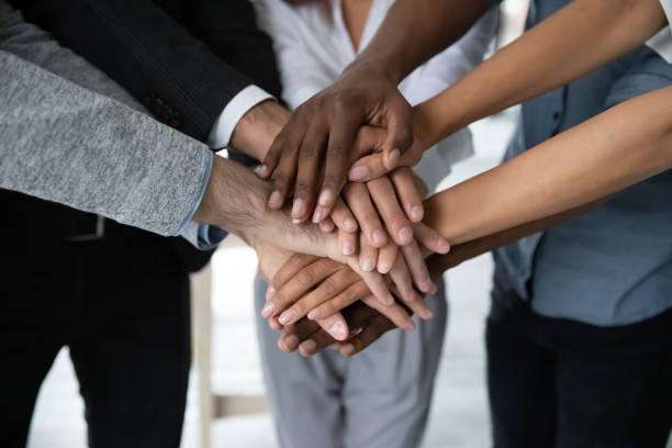 istock Close up of diverse colleagues engaged in teambuilding activity 1655471764