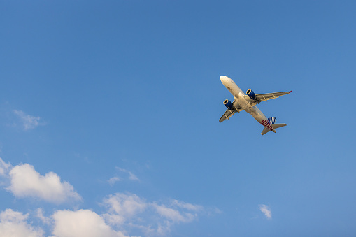 Airplane flying on blue sky