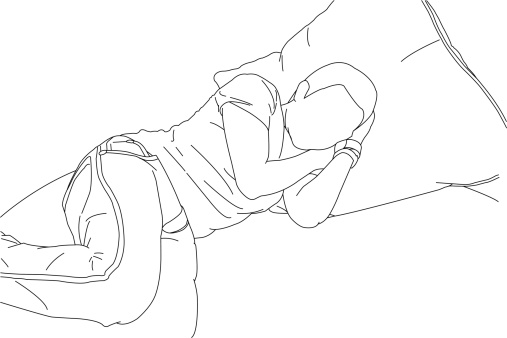 A line drawing of someone sleeping