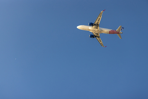 Airplane flying on blue sky