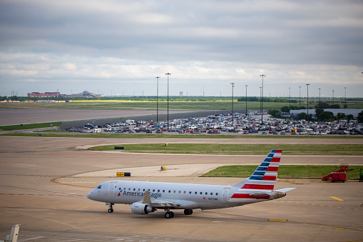 American Eagle Embraer ERJ-175LR aircraft with registration N213NN operated by Envoy Air taxiing at Dallas/Fort Worth International Airport in April 2022