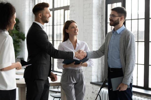 istock Businesspeople shake hands get acquainted at meeting 1655567634
