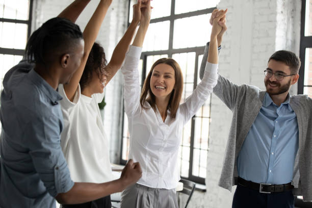 istock Overjoyed multiracial businesspeople engaged in teambuilding activity 1655568018