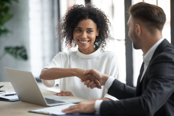 istock Smiling diverse businesspeople shake hands greeting at meeting 1655568152