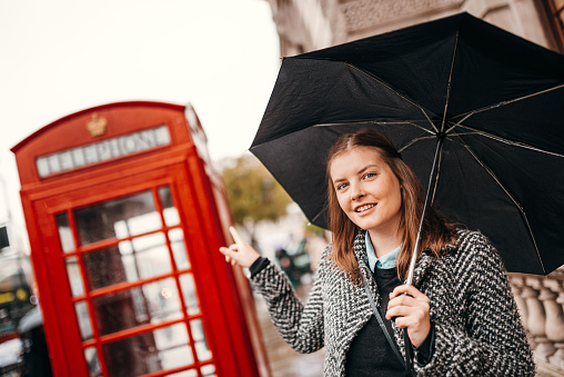 tourist girl with arm crossed in london