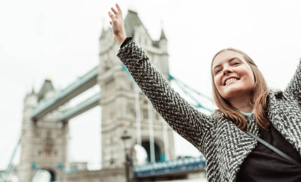 istock happiness woman under the tower bridge 1655581014