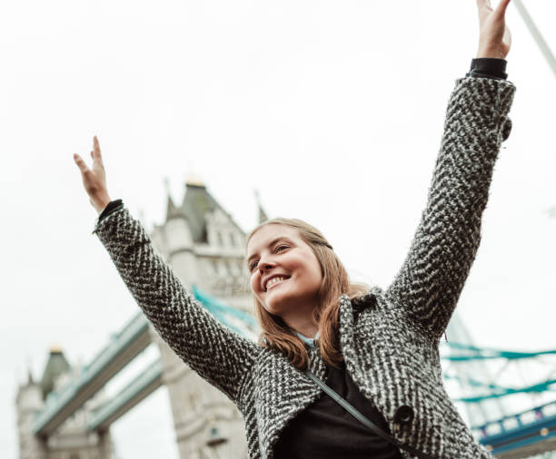 istock happiness woman under the tower bridge 1655582072