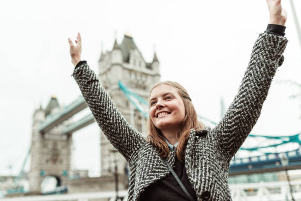 istock happiness woman under the tower bridge 1655582090