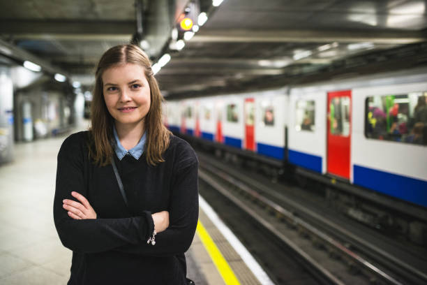 istock smiling woman at the train station 1655585237