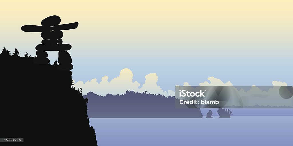 inukshuk Inukshuk on top of a cliff. Arctic stock vector