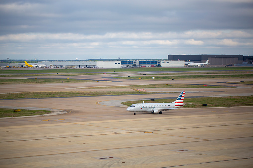 American Eagle Embraer ERJ-175LR aircraft with registration N202NN operated by Envoy Air taxiing at Dallas/Fort Worth International Airport in April 2022