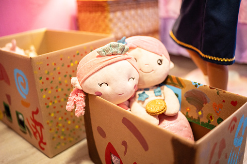 Close-up of a dolls on a cardboard box at home