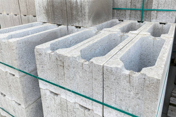 istock Stack on Pallet of Concrete Cinder Blocks, Grey Uniformed brick Shapes building material. New for use on construction site in Europe. 1655656781