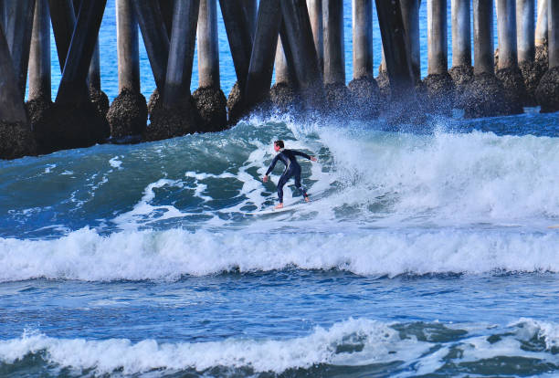 istock Surfer at Speed on a Wave in Huntington Beach 1655668352