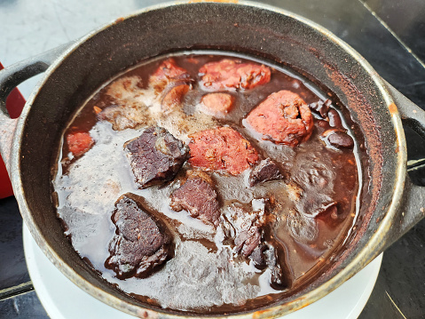 Typical brazilian dish made with black beans and pork meats