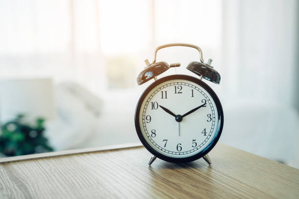 istock Closeup alarm clock having a good day with background. 1655746225