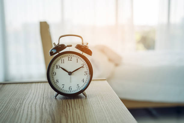 istock Closeup alarm clock having a good day with background. 1655748341