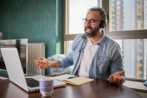 istock Mature fashionable man working at home 1655796873