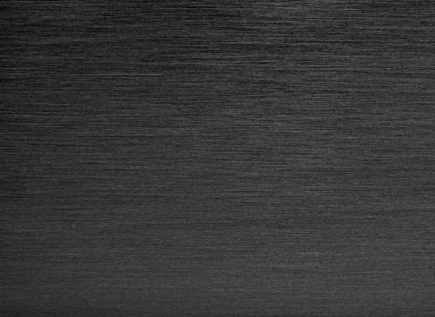 Simple background of black brushed stainless steel.