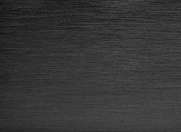 Black Brushed Metal Background Simple background of black brushed stainless steel. grooved stock pictures, royalty-free photos & images