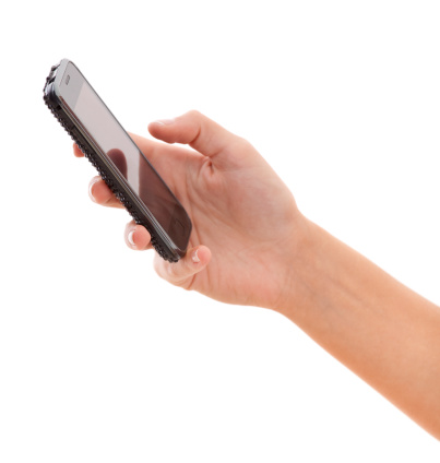 Smartphone in woman hand, side view, typing, isolated on white background