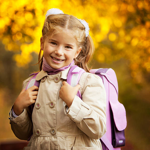 Outdoor Portrait of Little Schoolgirl stock photo