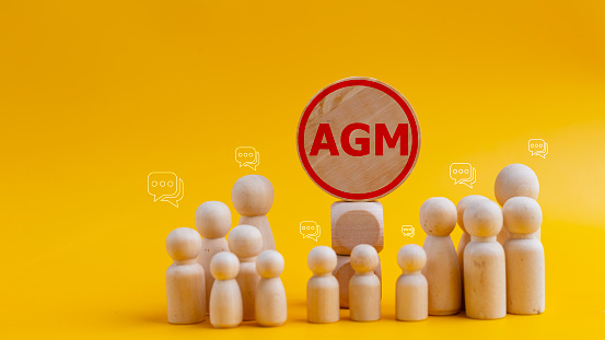 Conceptual image of a group of people with the word AGM. business concept. AGM annual general meeting