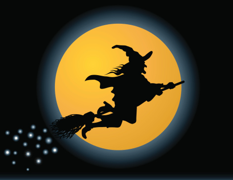 A witch flying in front of a harvest moon, the iconic symbol of Halloween.
