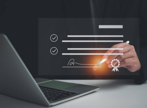 istock Businessman use electronic pen sign signature on electronic E-signing, data sheet document management, Electronic signature and paperless office concept. 1655939501