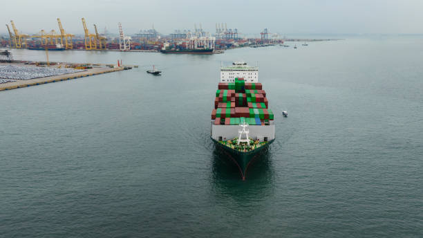 istock aerial front view cargo container ship carrying in sea import export goods and distributing products to dealer consumers, global business transportation by container ship open sea, 1655952654
