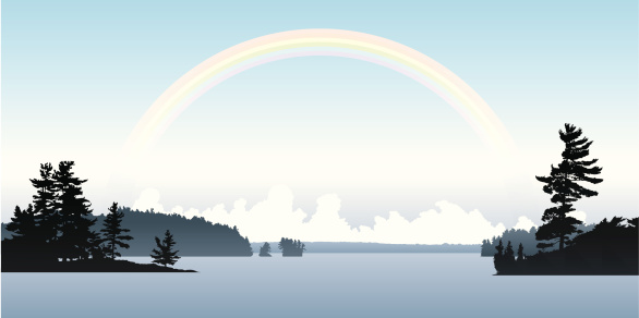 Soft rainbow above a northern Ontario lake.