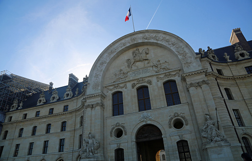 Entrance arch facade to The Army Museum in Les Invalides complex. No fee for this area. Picture made on 2/20/2023
