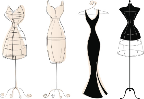 3 vintage-style dress forms and an elegant dress on a hanger.