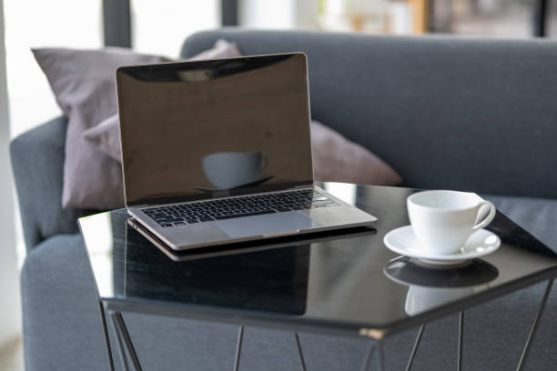 istock white cup, laptop, homeworking, teleworking, coffee and laptop, mug, espresso, smoking coffee, close up shot of a cup of coffee, cafeine, working from home 1656046772