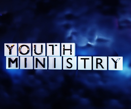 Youth ministry words on the white cubes in the dark blue sky background 3d rendering