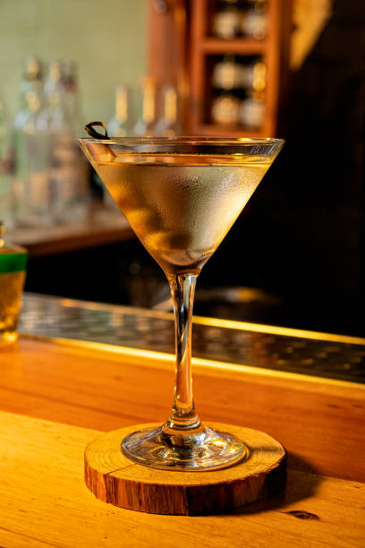 istock Classic dry martini cocktail with olives on blurred background bar. 1656073467