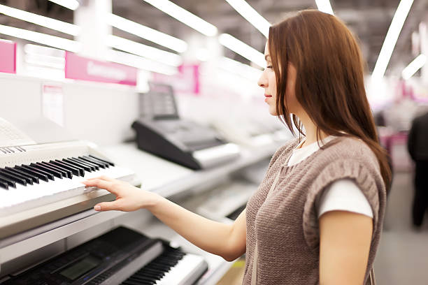 The woman buys a synthesizer