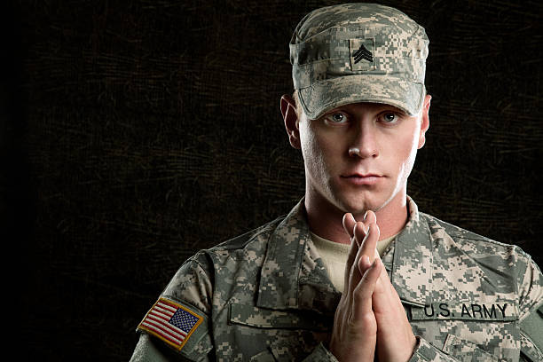 istock American Soldier Series: Young Sergeant against Dark Background 165615590