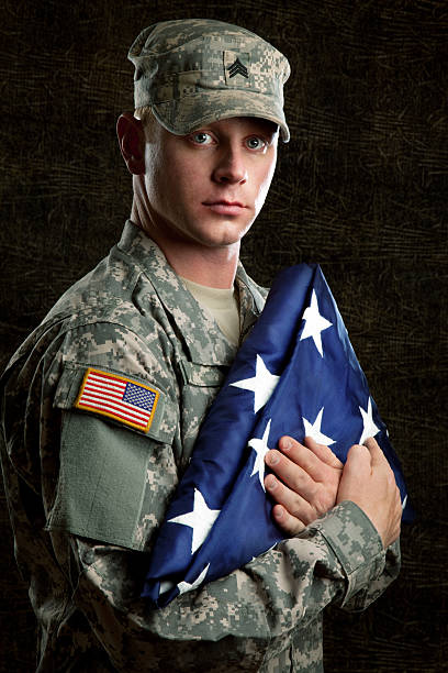 istock American Soldier Series: Young Sergeant against Dark Background 165615591
