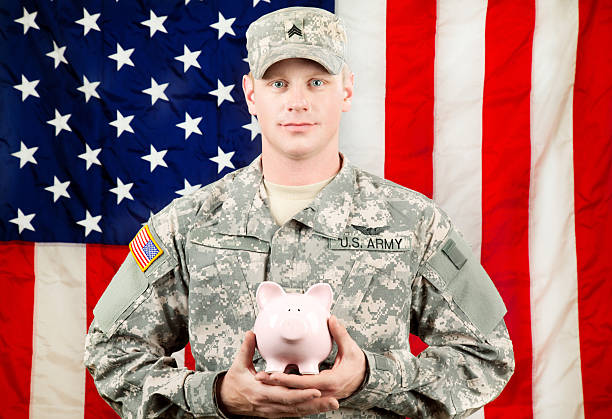 istock American Soldier Series: Young Sergeant Standing against USA Flag 165615698