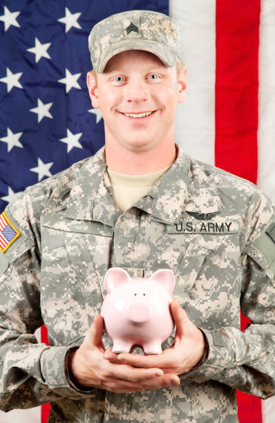 istock American Soldier Series: Young Sergeant Standing against USA Flag 165615702