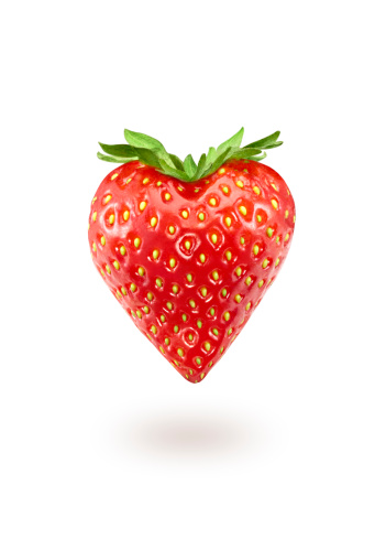 Strawberry-heart close-up isolated over a white background