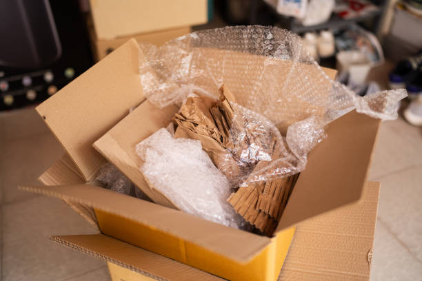 istock Cardboard box with bubble pack and kraft paper for packaging 1656167208