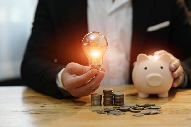 istock Saving money with hands putting coins 1656177739