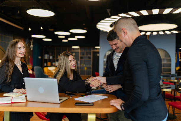 istock Entrepreneur shaking hands with employee at labor market 1656192629