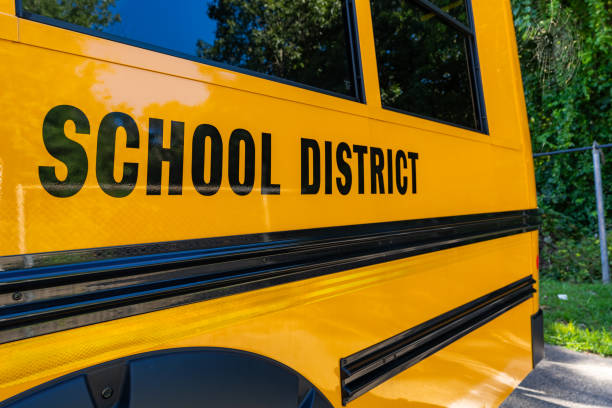 istock Side of a parked yellow school district bus 1656209265