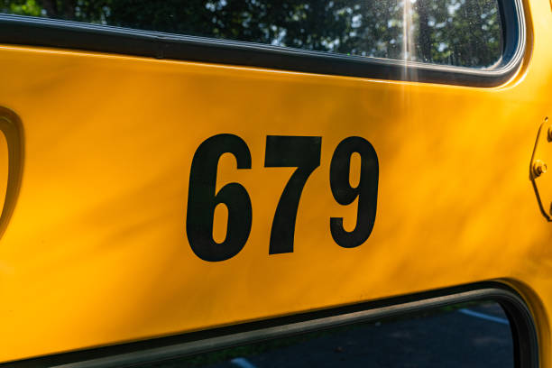 istock Side of a parked yellow school bus number 679 1656240499