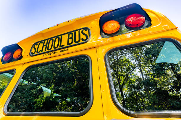 istock rear of a parked yellow school bus 1656280142
